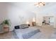 Carpeted primary bedroom featuring decor, neutral walls, and a ceiling fan at 5127 W Dobbins Rd, Laveen, AZ 85339