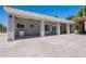 Expansive back patio with ceiling fans, perfect for entertaining with ample space and style at 5127 W Dobbins Rd, Laveen, AZ 85339