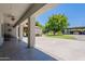 Spacious covered patio with an open view of the lush landscaped backyard and gazebo at 5127 W Dobbins Rd, Laveen, AZ 85339