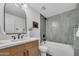 Stylish bathroom featuring modern vanity with updated fixtures and tiled shower over tub at 6233 E Pinchot Ave, Scottsdale, AZ 85251