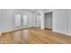 Bright bedroom features wood floors, closet, and double glass doors to backyard at 6233 E Pinchot Ave, Scottsdale, AZ 85251