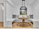 Charming eat-in nook with bench seating, decorative pillows, and a stylish light fixture for cozy dining at 6233 E Pinchot Ave, Scottsdale, AZ 85251
