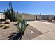 View of the house featuring desert landscaping, including cacti, and a two-car garage at 6233 E Pinchot Ave, Scottsdale, AZ 85251
