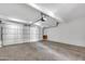 Spacious garage features concrete floors and an automatic door at 6233 E Pinchot Ave, Scottsdale, AZ 85251