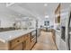 Open kitchen with an island, stainless appliances, and a view of an adjacent eat-in nook and living room at 6233 E Pinchot Ave, Scottsdale, AZ 85251