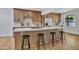 Bright kitchen featuring stainless steel appliances, a central island with bar seating, and modern cabinetry at 6233 E Pinchot Ave, Scottsdale, AZ 85251