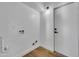 White laundry room features bright lighting and a white door at 6233 E Pinchot Ave, Scottsdale, AZ 85251