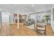 Bright, open-concept living room with modern decor and seamless flow to the kitchen area at 6233 E Pinchot Ave, Scottsdale, AZ 85251