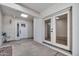 Covered patio features access to home through glass double doors at 6233 E Pinchot Ave, Scottsdale, AZ 85251
