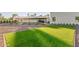 Manicured backyard featuring artificial grass and stylish features, creating an inviting outdoor space at 6401 E Larkspur Dr, Scottsdale, AZ 85254