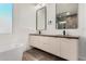 Modern bathroom featuring double vanity sinks, stylish mirrors, and contemporary fixtures at 6401 E Larkspur Dr, Scottsdale, AZ 85254