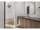 Modern bathroom featuring a wood vanity and neutral-colored walls and flooring at 6401 E Larkspur Dr, Scottsdale, AZ 85254