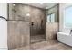 Modern bathroom features a large tiled shower with glass surround and a separate soaking tub at 6401 E Larkspur Dr, Scottsdale, AZ 85254