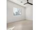 Neutral bedroom with a ceiling fan and a window offering natural light at 6401 E Larkspur Dr, Scottsdale, AZ 85254