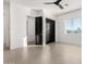 Bright bedroom with two black doors, a ceiling fan and a window at 6401 E Larkspur Dr, Scottsdale, AZ 85254