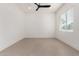 Bright bedroom with a ceiling fan and a large window, perfect for relaxation at 6401 E Larkspur Dr, Scottsdale, AZ 85254
