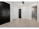 Bedroom with doors and glimpse into bathroom at 6401 E Larkspur Dr, Scottsdale, AZ 85254