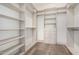 Spacious walk-in closet with custom shelving and drawers offers ample storage at 6401 E Larkspur Dr, Scottsdale, AZ 85254