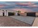 Spacious driveway leads to an attached garage on a modern-designed home at 6401 E Larkspur Dr, Scottsdale, AZ 85254