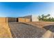 Paver driveway leading to a modern home with a gate, showcasing curb appeal and privacy at 6401 E Larkspur Dr, Scottsdale, AZ 85254