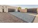 Long, paved driveway leading to a modern garage with ample parking space and convenient access at 6401 E Larkspur Dr, Scottsdale, AZ 85254