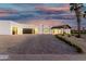 Stunning single-story home with a modern design, three-car garage, and porte cochere at 6401 E Larkspur Dr, Scottsdale, AZ 85254