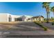Contemporary home with a large garage and porte cochere, offering ample parking and a sleek, modern aesthetic at 6401 E Larkspur Dr, Scottsdale, AZ 85254