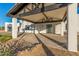 Inviting covered entryway featuring desert landscaping and black and white modern design at 6401 E Larkspur Dr, Scottsdale, AZ 85254