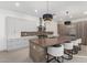 Modern kitchen featuring a large center island with seating and stainless steel appliances at 6401 E Larkspur Dr, Scottsdale, AZ 85254