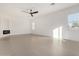 Bright and airy living room with a minimalist design, tile flooring, and ample natural light at 6401 E Larkspur Dr, Scottsdale, AZ 85254