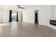 Open living space with tile floors, a fireplace, and sliding glass doors leading to the backyard at 6401 E Larkspur Dr, Scottsdale, AZ 85254