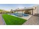 Inviting backyard pool with a sleek design and stylish fire features offers a relaxing outdoor space at 6401 E Larkspur Dr, Scottsdale, AZ 85254