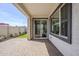 View of the covered patio area with paver flooring and sliding glass door access to the home at 650 W Laredo St, Chandler, AZ 85225