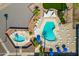 Aerial view of community pool with relaxing lounge chairs, cabanas, and inviting social spaces at 701 S Dobson Rd # 438, Mesa, AZ 85202