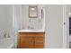 Bathroom featuring a vanity with wood cabinets, large mirror, and shower/tub at 701 S Dobson Rd # 438, Mesa, AZ 85202