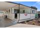 Exterior view of a manufactured home with a carport and covered porch at 701 S Dobson Rd # 438, Mesa, AZ 85202