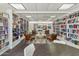 Community library with book lined shelves and comfortable seating at 701 S Dobson Rd # 438, Mesa, AZ 85202