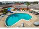 Stunning aerial view of a community pool, featuring ample lounge chairs and seating areas, perfect for relaxation at 701 S Dobson Rd # 438, Mesa, AZ 85202