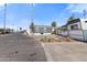 Charming mobile homes in a well-maintained community with lush landscaping under a clear, sunny sky at 701 S Dobson Rd # 438, Mesa, AZ 85202