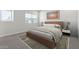 Comfortable bedroom with neutral colors, soft textures, and ample natural light at 7448 S 75Th Ln, Laveen, AZ 85339
