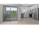 Well-lit kitchen featuring sleek appliances and access to an outdoor balcony with scenic views at 7448 S 75Th Ln, Laveen, AZ 85339