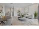 Spacious living room with natural light, modern decor, and comfortable seating arrangement at 7448 S 75Th Ln, Laveen, AZ 85339