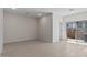 Spacious living room with tile flooring and sliding glass doors for natural light at 7448 S 75Th Ln, Laveen, AZ 85339