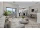 Inviting living space featuring neutral tones and a modern kitchen with stainless steel appliances at 7448 S 75Th Ln, Laveen, AZ 85339
