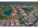 Aerial view of a residential neighborhood, featuring houses, streets, and community golf course and lakes at 8120 E Cortez Dr, Scottsdale, AZ 85260