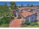 Bird's-eye view of house featuring a tile roof, well-maintained landscaping, and a private driveway at 8120 E Cortez Dr, Scottsdale, AZ 85260