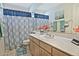 Bathroom featuring vanity with cabinets, mirror, sink, toilet, and shower with a patterned curtain at 8120 E Cortez Dr, Scottsdale, AZ 85260