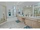 Well-lit bathroom with double vanity, soaking tub, and separate shower at 8120 E Cortez Dr, Scottsdale, AZ 85260
