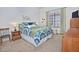 Well-lit bedroom with a bed, side table, and dresser, offering a comfortable living space at 8120 E Cortez Dr, Scottsdale, AZ 85260
