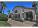 Charming home exterior showcasing desert landscaping, tiled roof, and arched windows at 8120 E Cortez Dr, Scottsdale, AZ 85260